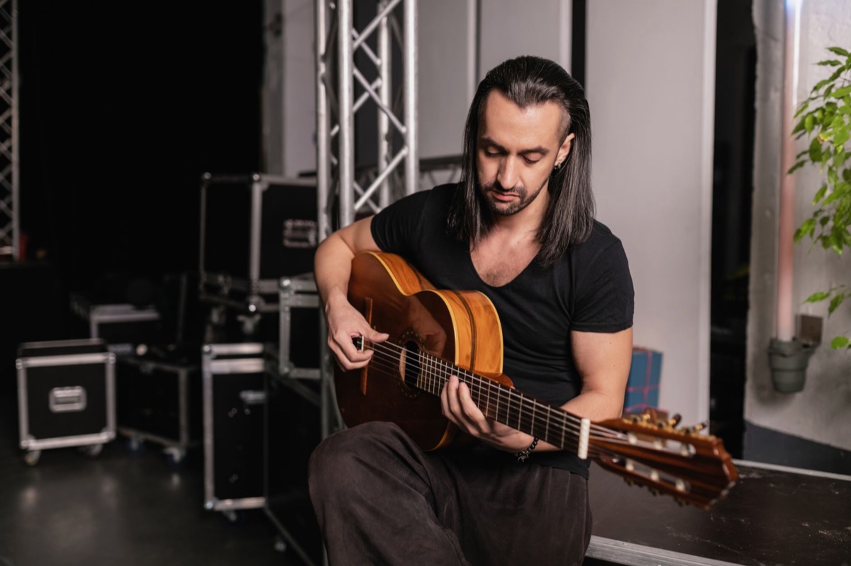 Spanish guitarist in recording studio
